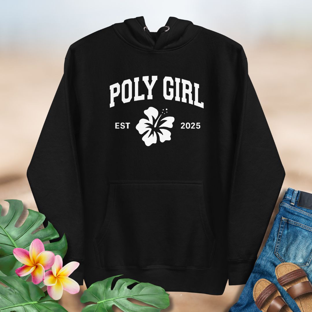 Black hoodie with 'Poly Girl Est. 2025' text and hibiscus flower design on a neutral background.