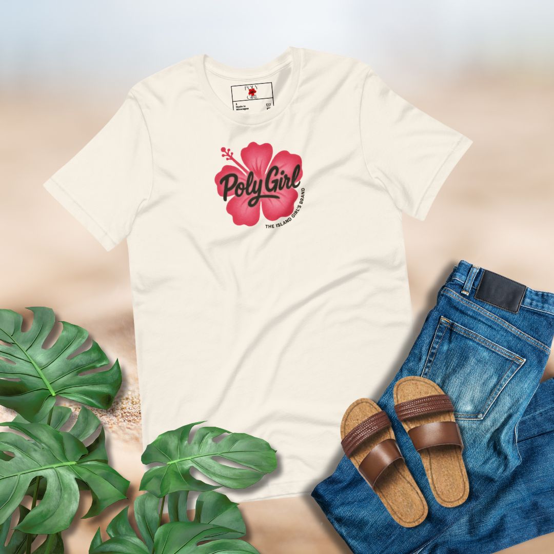 Cream colored t-shirt with 'PolyGirl' logo designed to look like a spray painted image, blue jeans, brown sandals, and green leaves on a light background