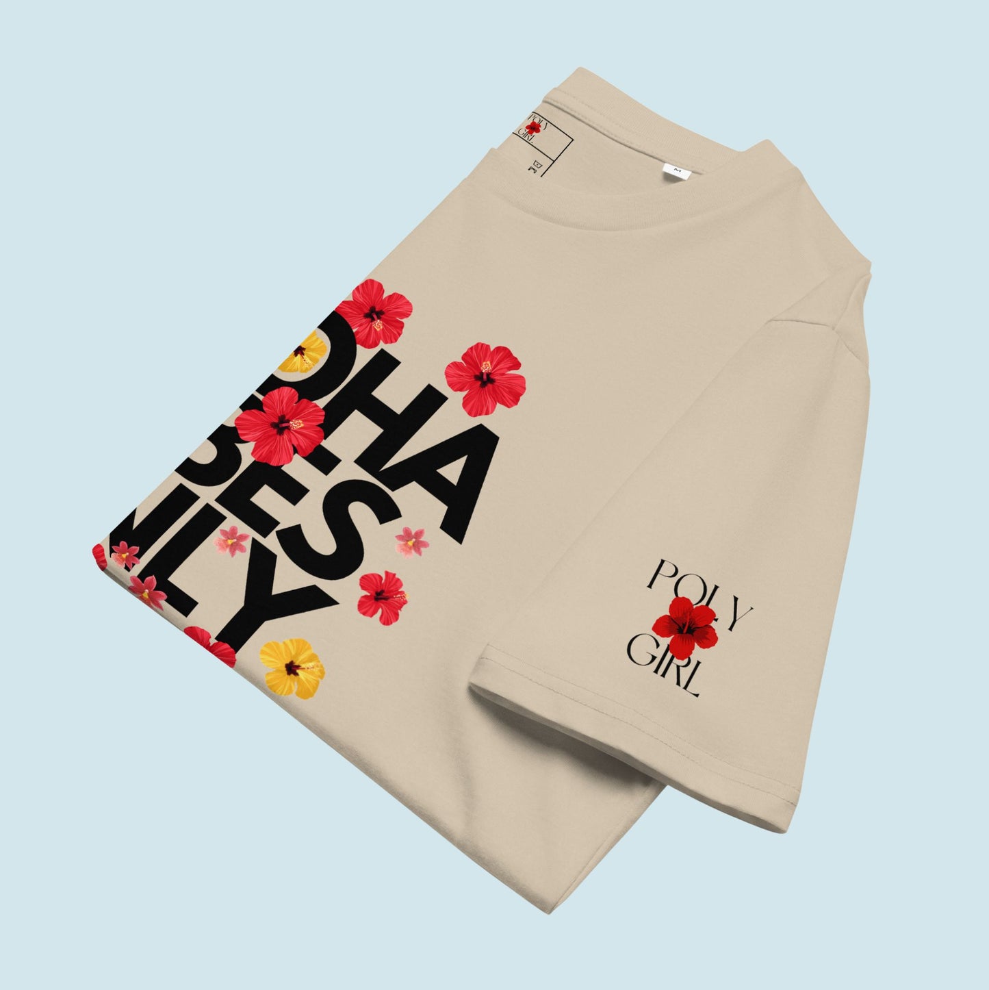 Beige tshirt folded with Poly Girl logo on Sleeve