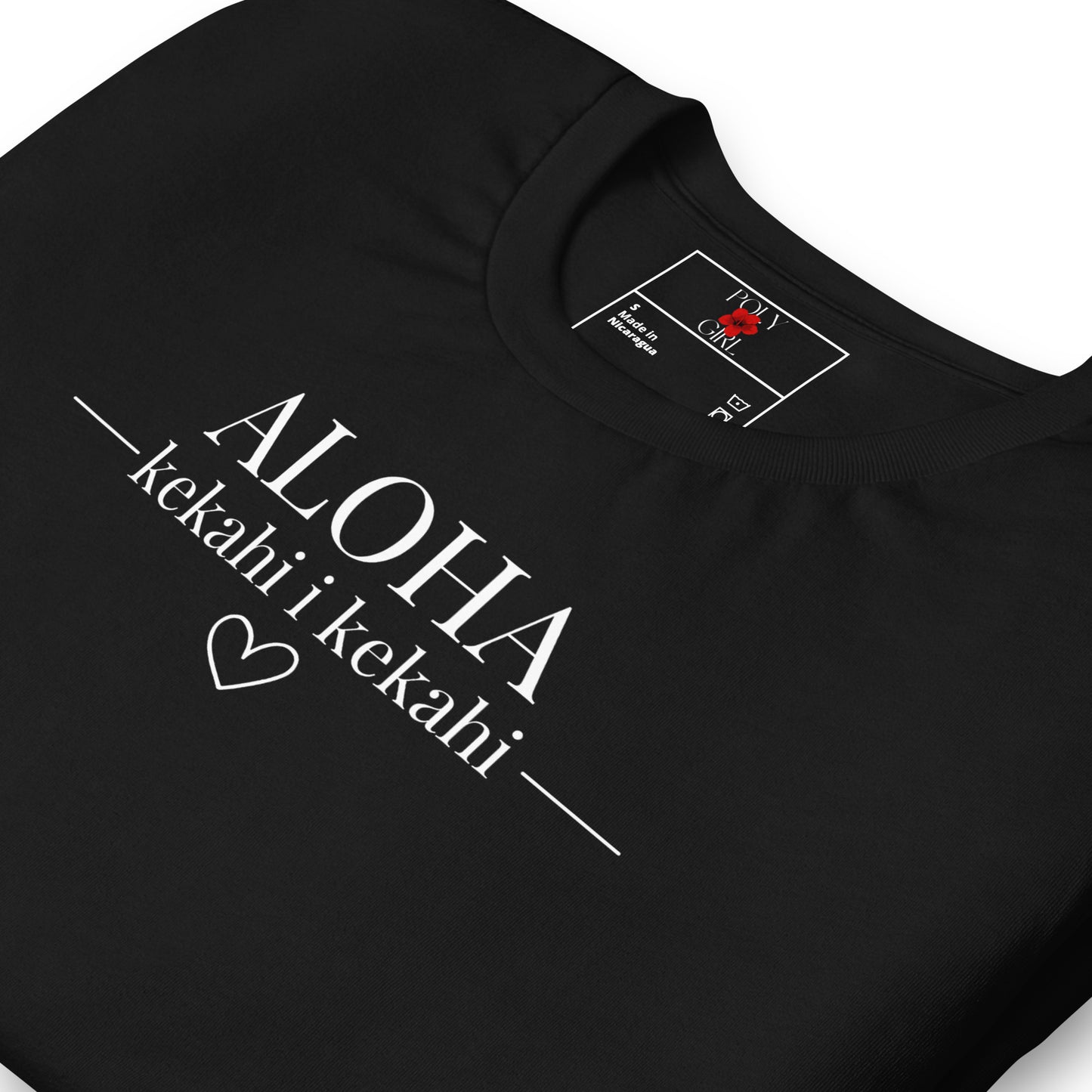 Folded view of black t-shirt by Poly Girl with Aloha Kekahi i Kekahi message on front