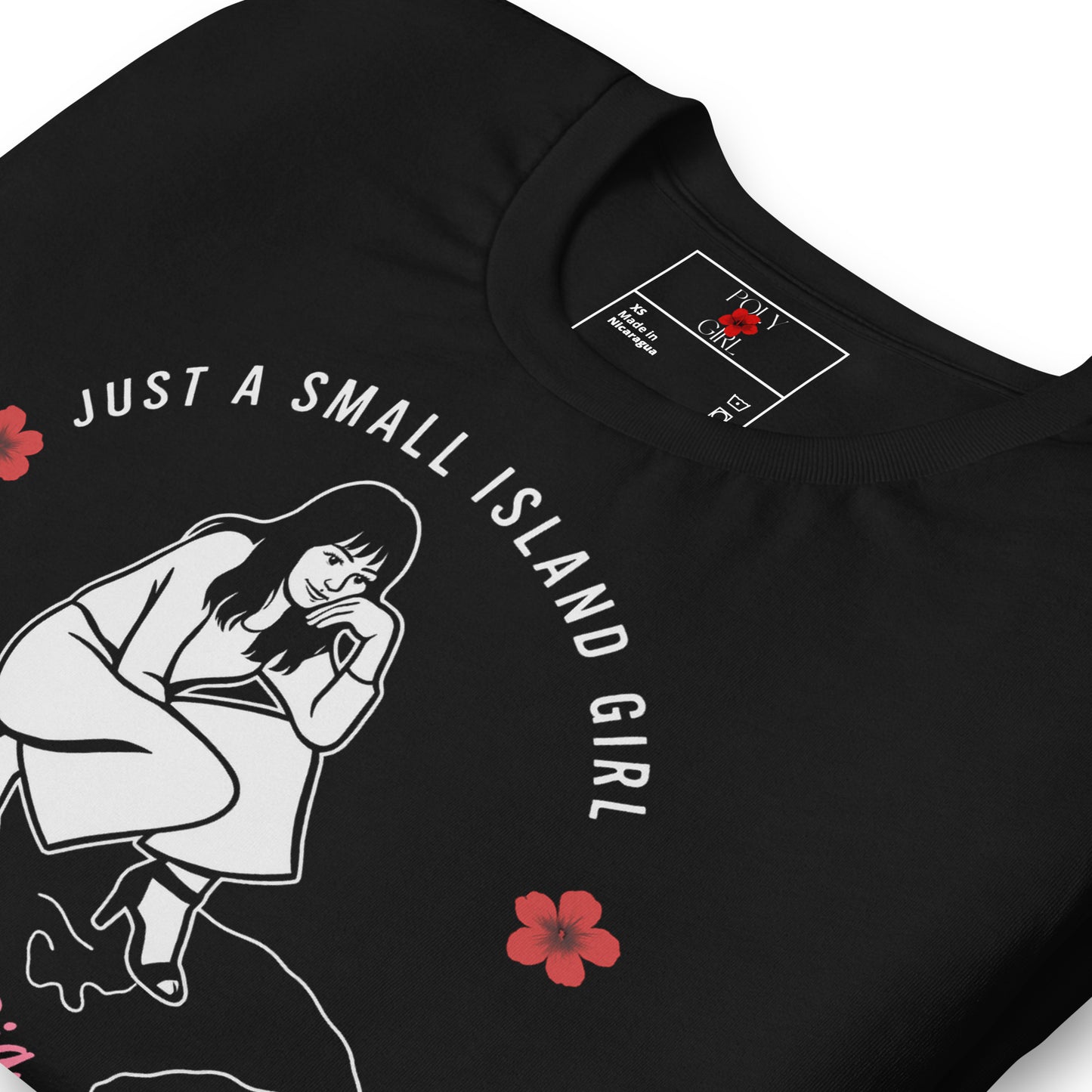 Just a small island girl tshirt in black and folded by Poly Girl