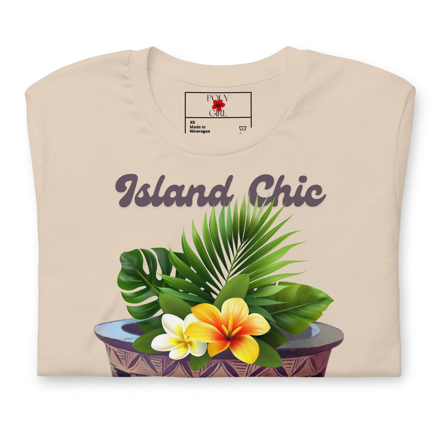 Folded view of Island Chic, Kava Mix tshirt with images of a kava bowl and tropical foliage.