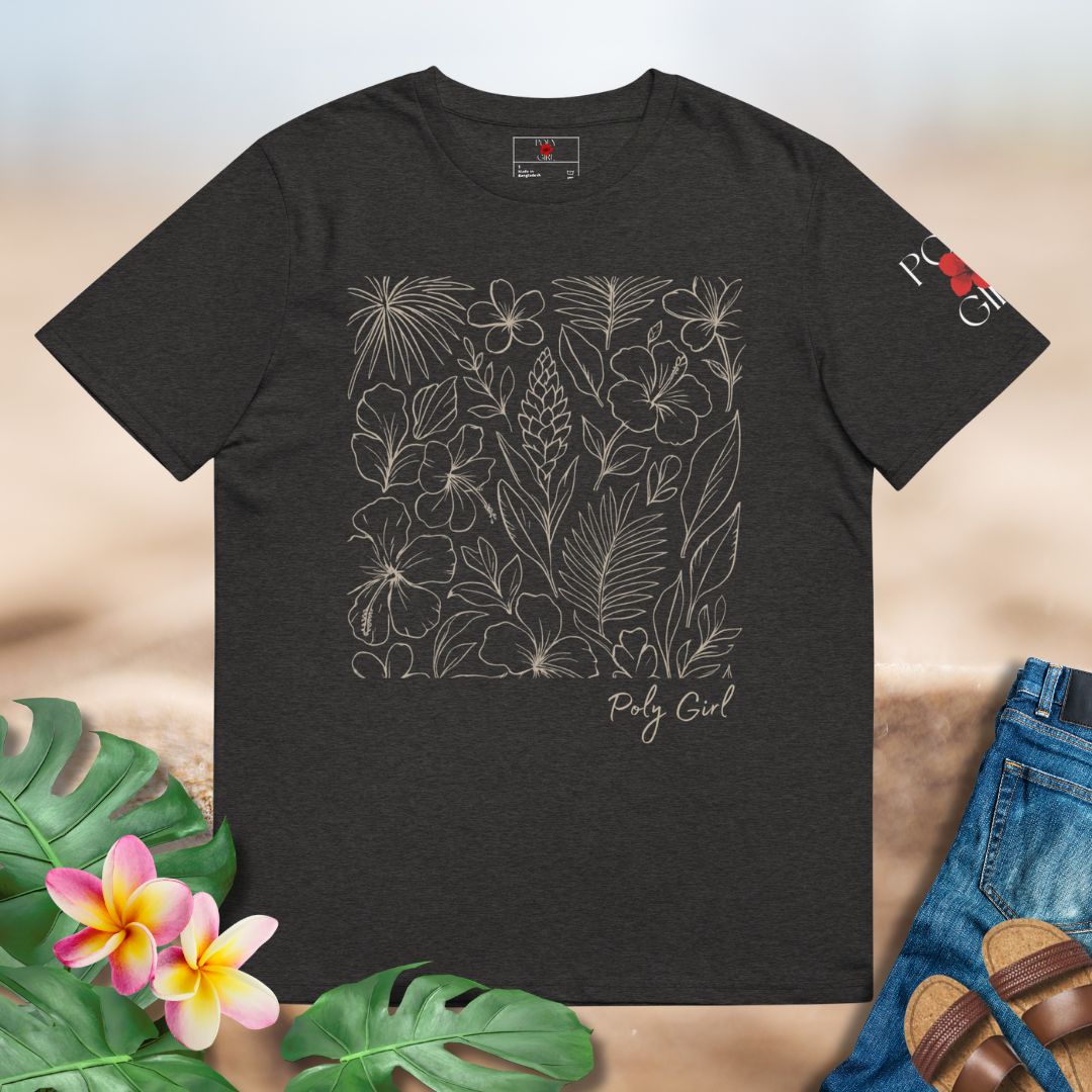 Black t-shirt with floral design and 'Poly Girl' text, surrounded by tropical leaves and flowers.