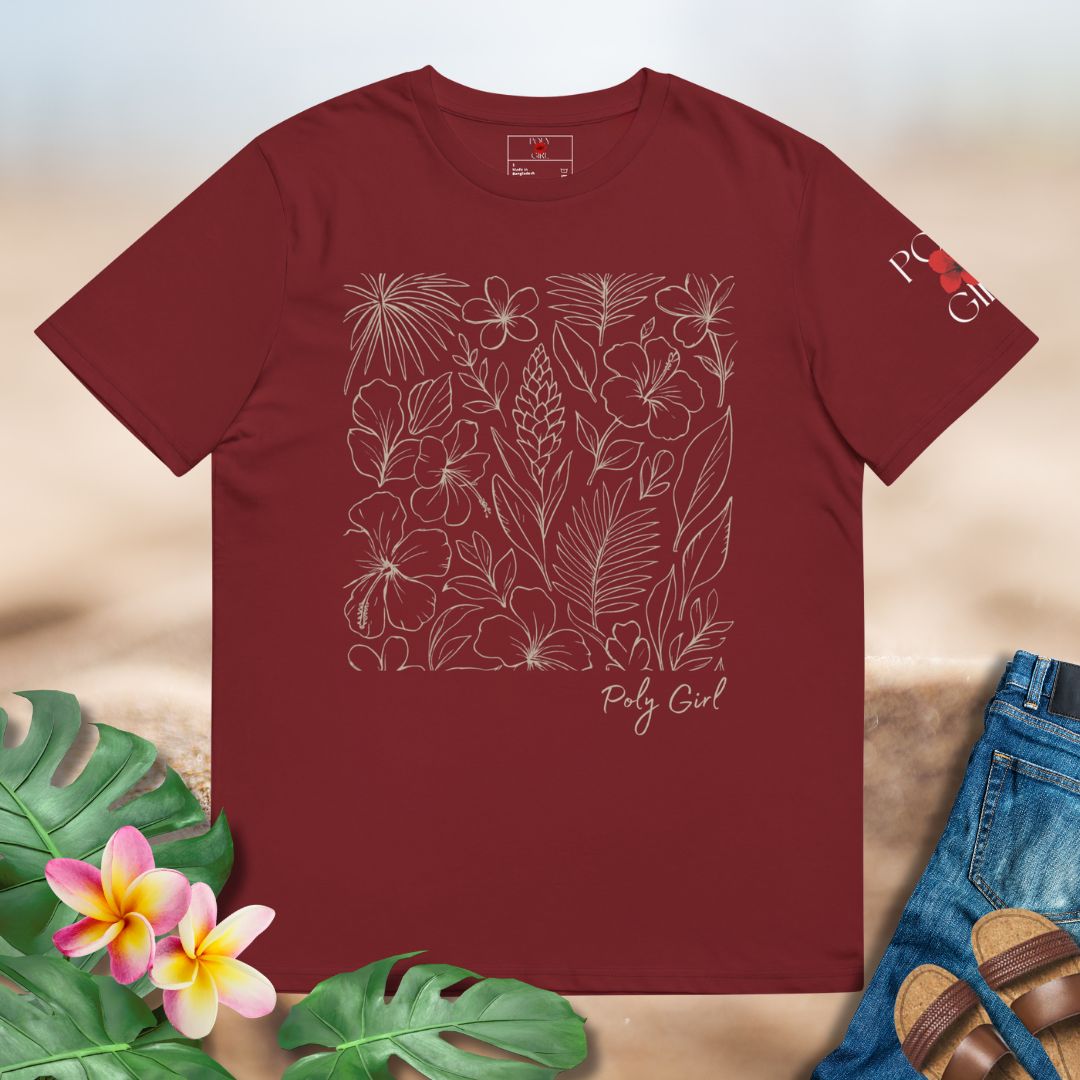 Red t-shirt with floral design and 'Poly Girl' text, surrounded by tropical plants and sandals.