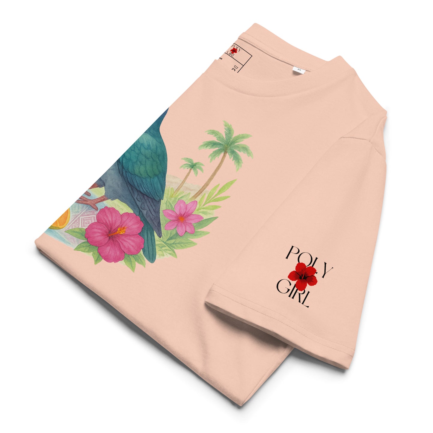 Side view of Lupe of the Islands peach t-shirt showing colorful pigeon and island florals in Poly Girl style.
