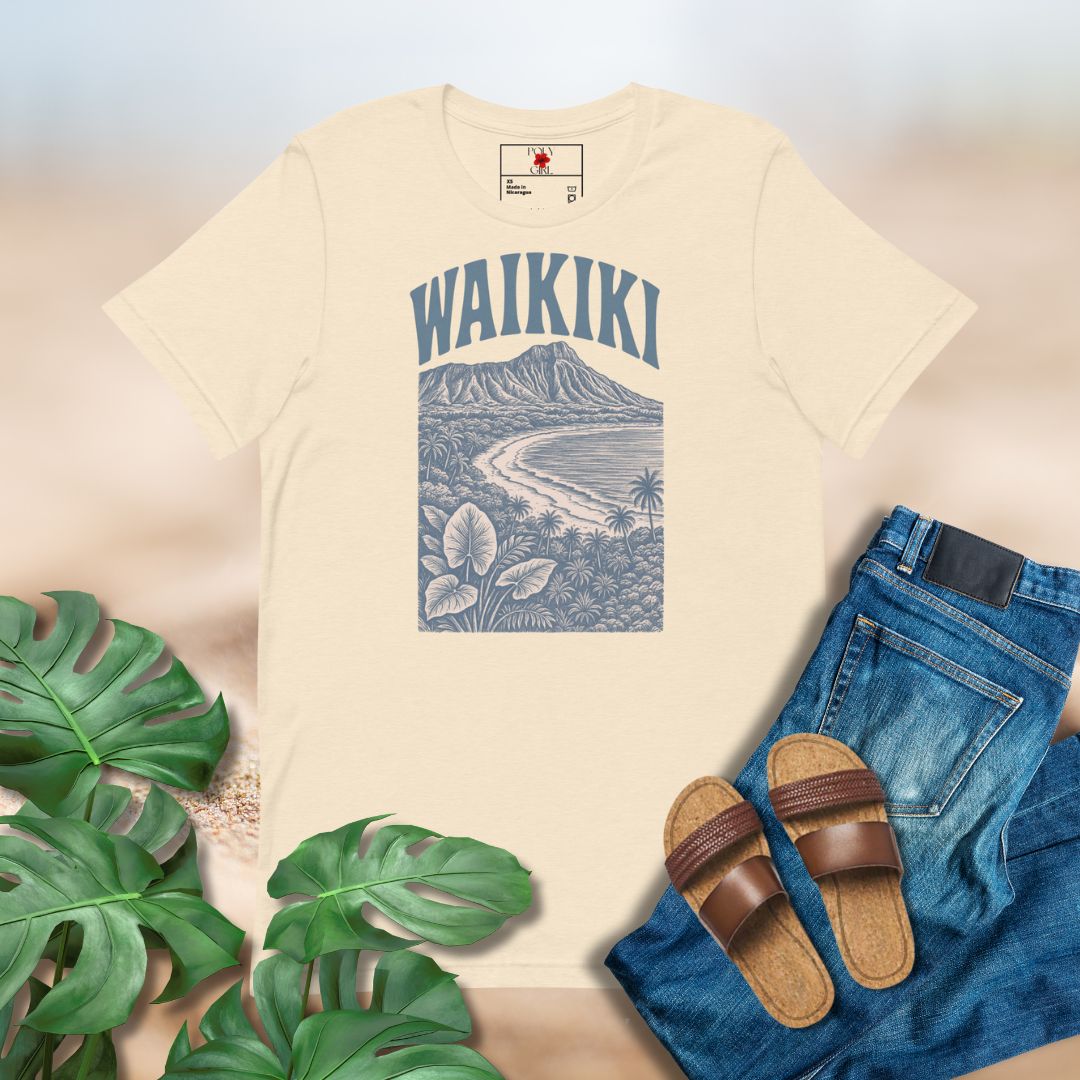 Beige t-shirt with 'Waikiki' graphic design, paired with jeans and sandals on a light background.
