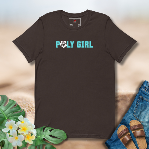 Brown t-shirt with 'POLY GIRL' text on a textured surface with plants and sandals.
