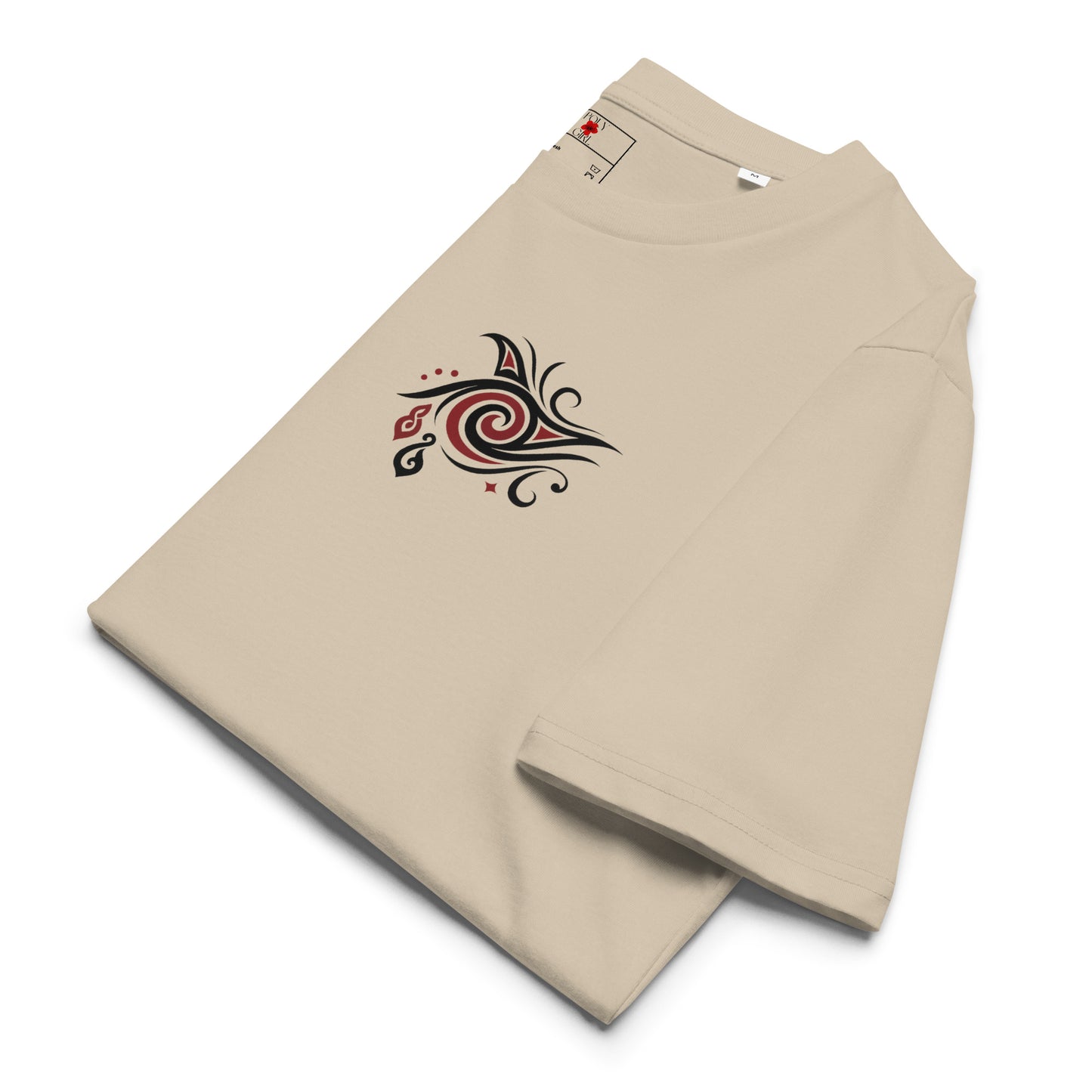 Close-up of Māori koru and spiral motif on Aroha Mai Aroha Atu tee