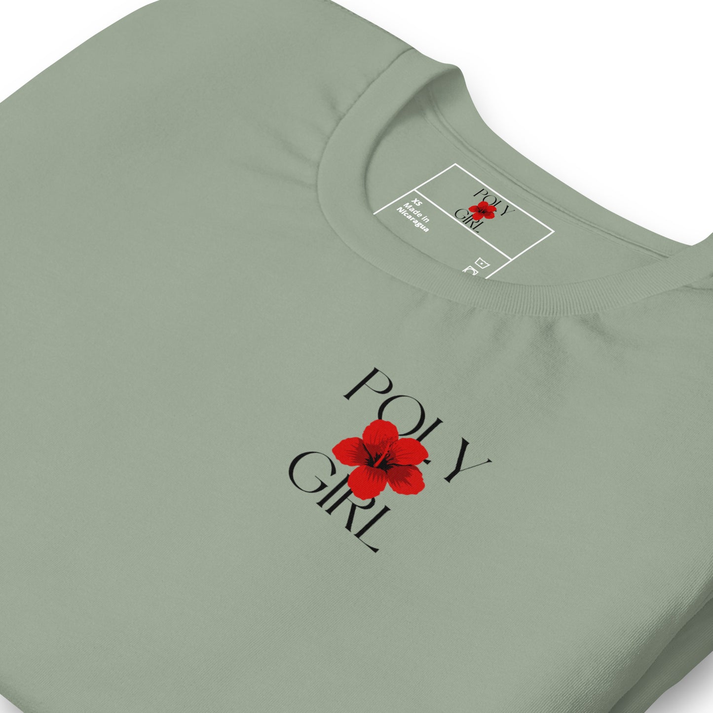 Folded view of front of wahine toa tee in sage green