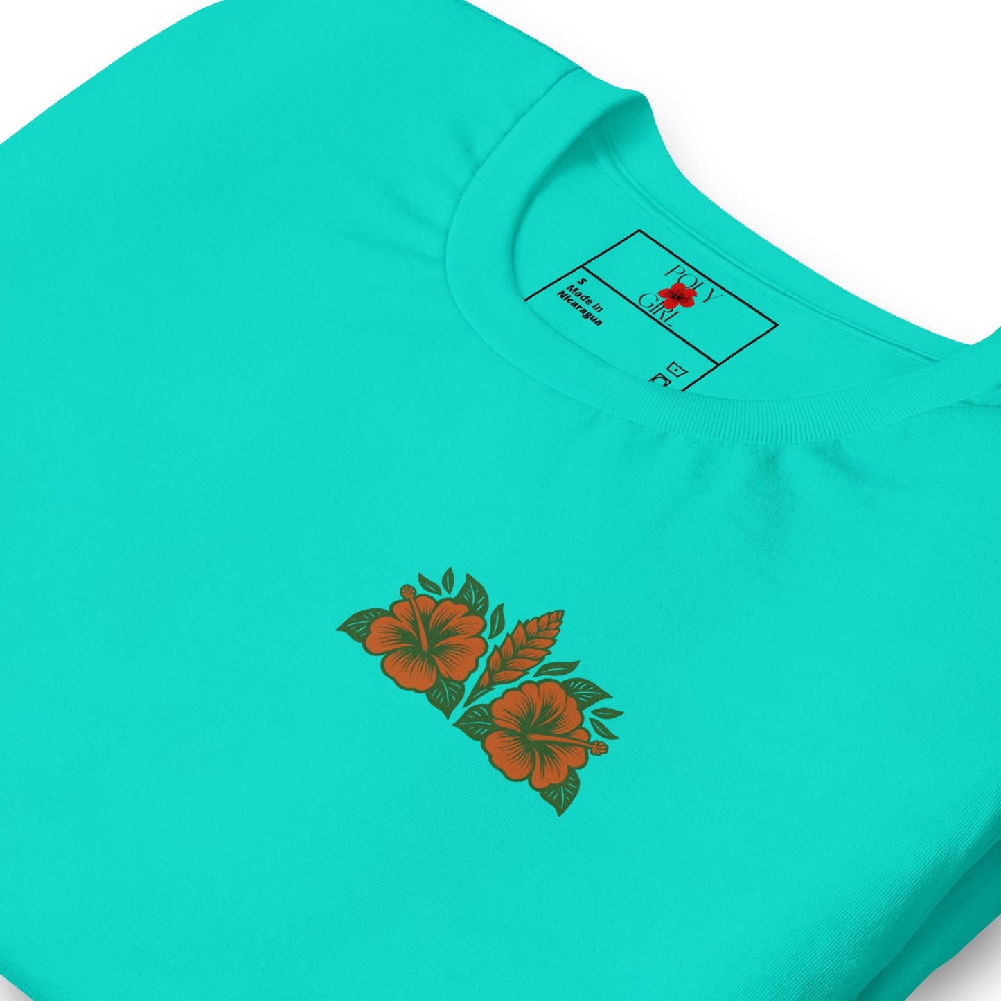 Folded teal women’s t-shirt showing red hibiscus back design.