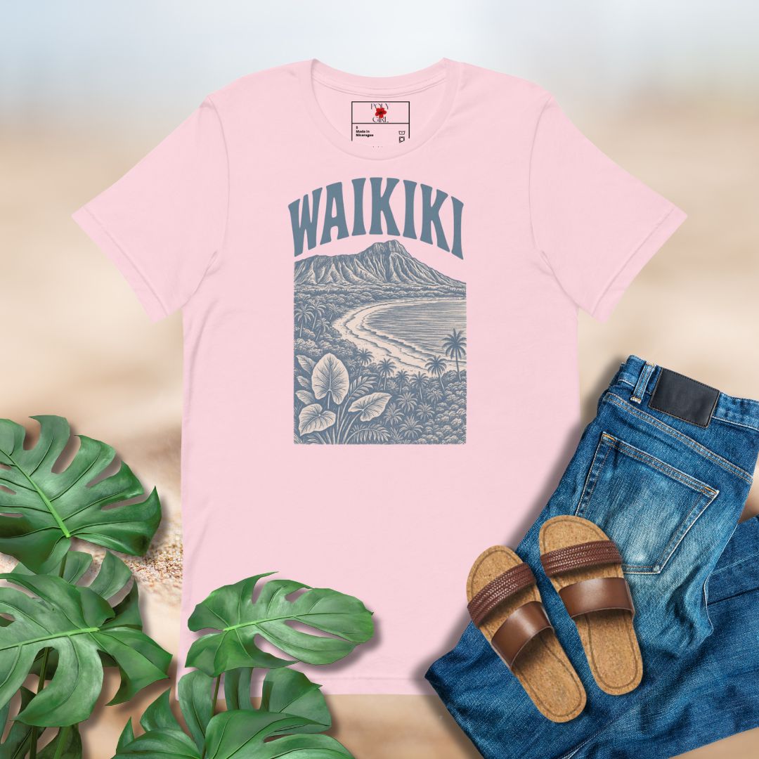 Pink t-shirt with 'Waikiki' design, jeans, sandals, and leaves on a light background