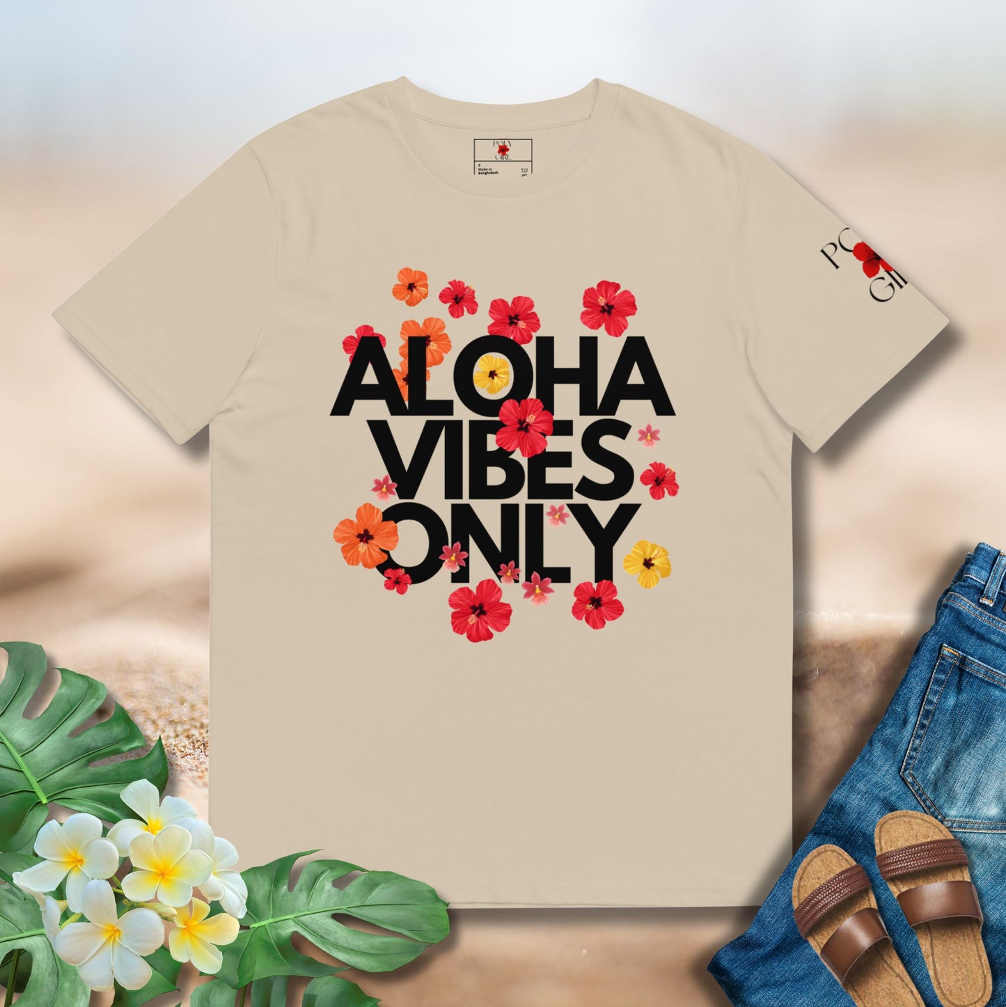 Beige t-shirt with 'Aloha Vibes Only' text and floral designs on a neutral background.