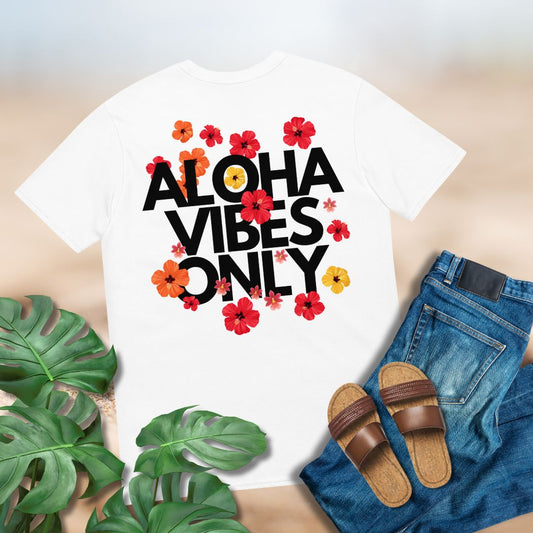 White t-shirt with 'Aloha Vibes Only' text and floral designs, paired with jeans and sandals on a light background.