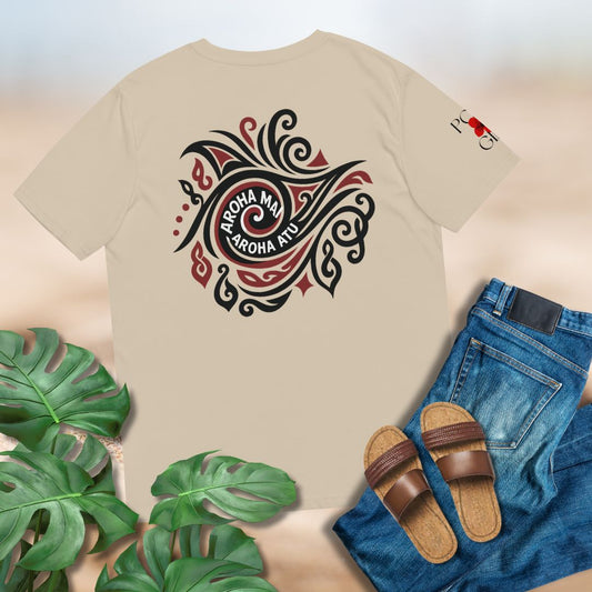 Beige t-shirt with a black and red design, paired with Maori greeting Aroha Mai, Aroha Atu, with jeans and sandals on a light background.