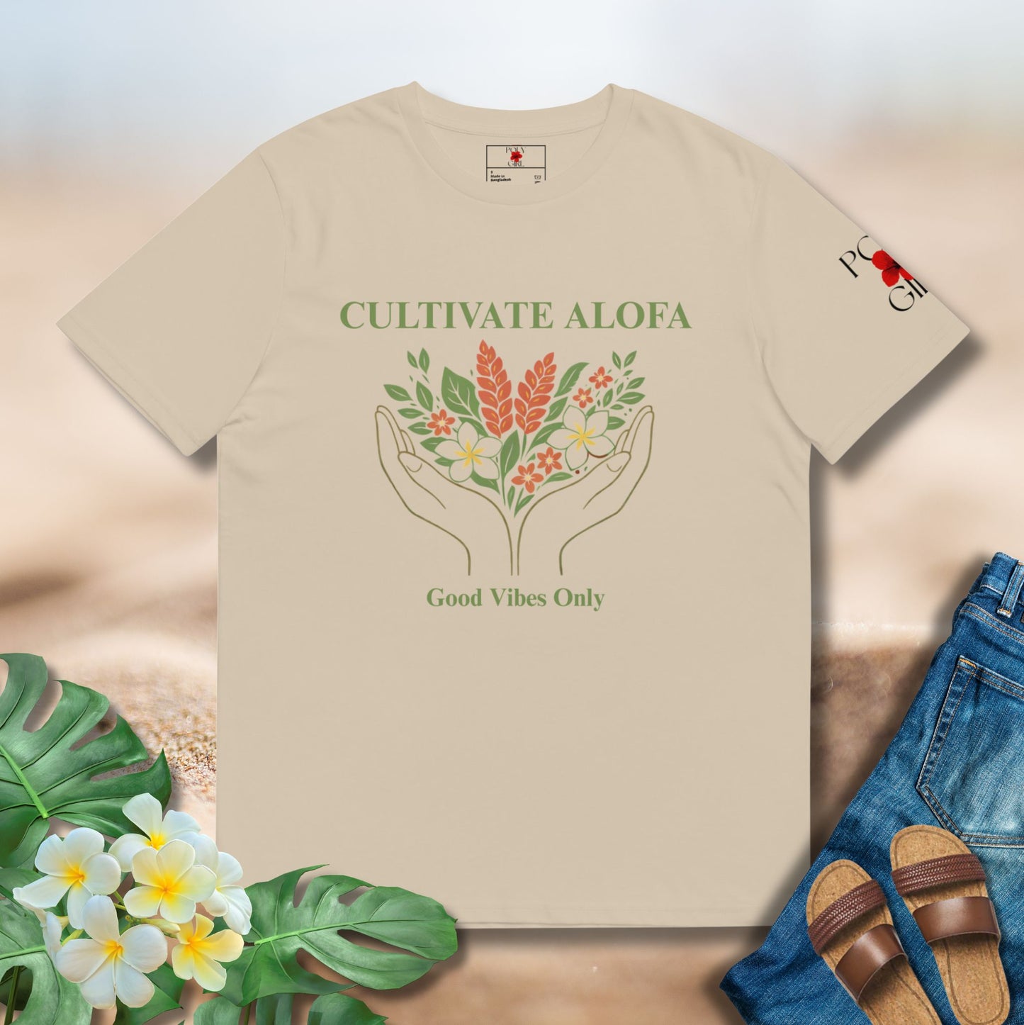 Beige shirt with Cultivate Alofa and Good Vibes Only hand and floral design