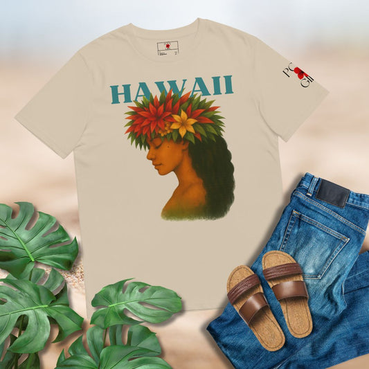 Beige t-shirt with a graphic of a woman wearing a flower headpiece and 'HAWAII' text, surrounded by tropical leaves and casual clothing.