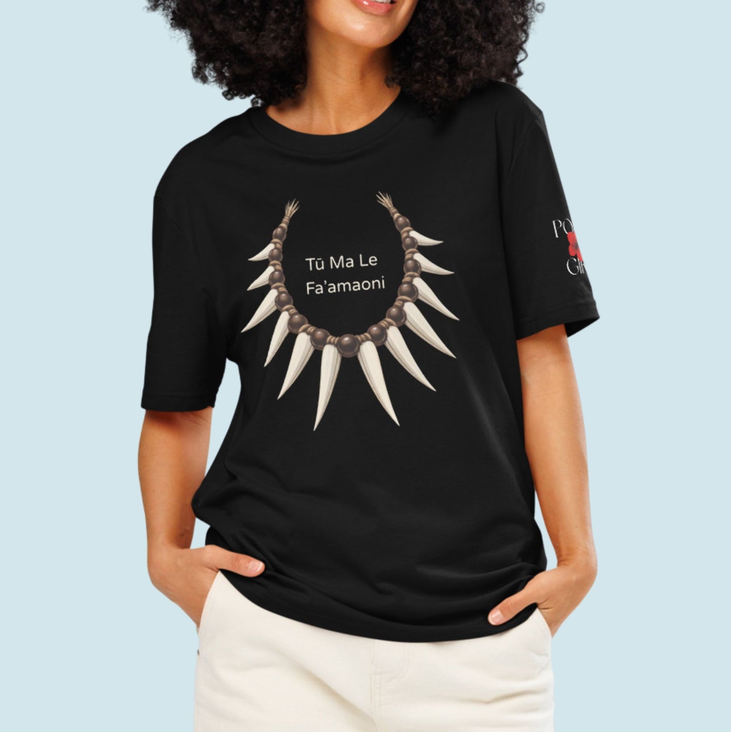 Person modeling a black tee with nifo ito and Tu ma Le Fa'amaoni