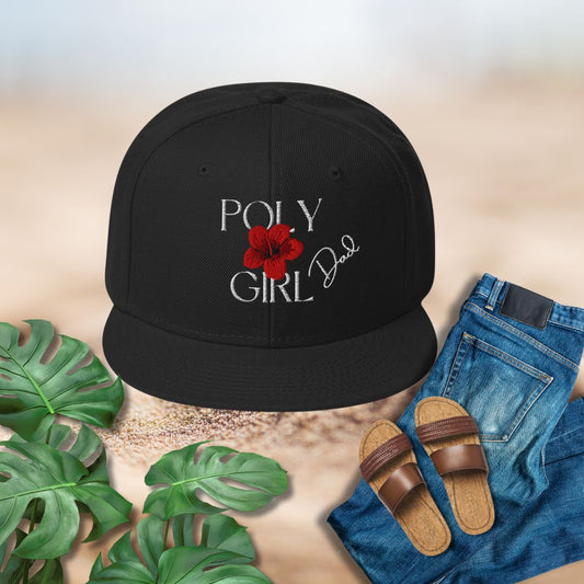 Black cap with 'Poly Girl' design, sandals, jeans, and plants on a textured surface