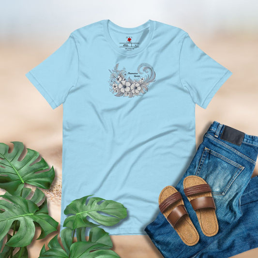 Light blue t-shirt with graphic design, paired with jeans and sandals on a neutral background.