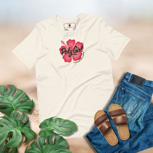 Cream colored t-shirt with 'PolyGirl' logo designed to look like a spray painted image, blue jeans, brown sandals, and green leaves on a light background