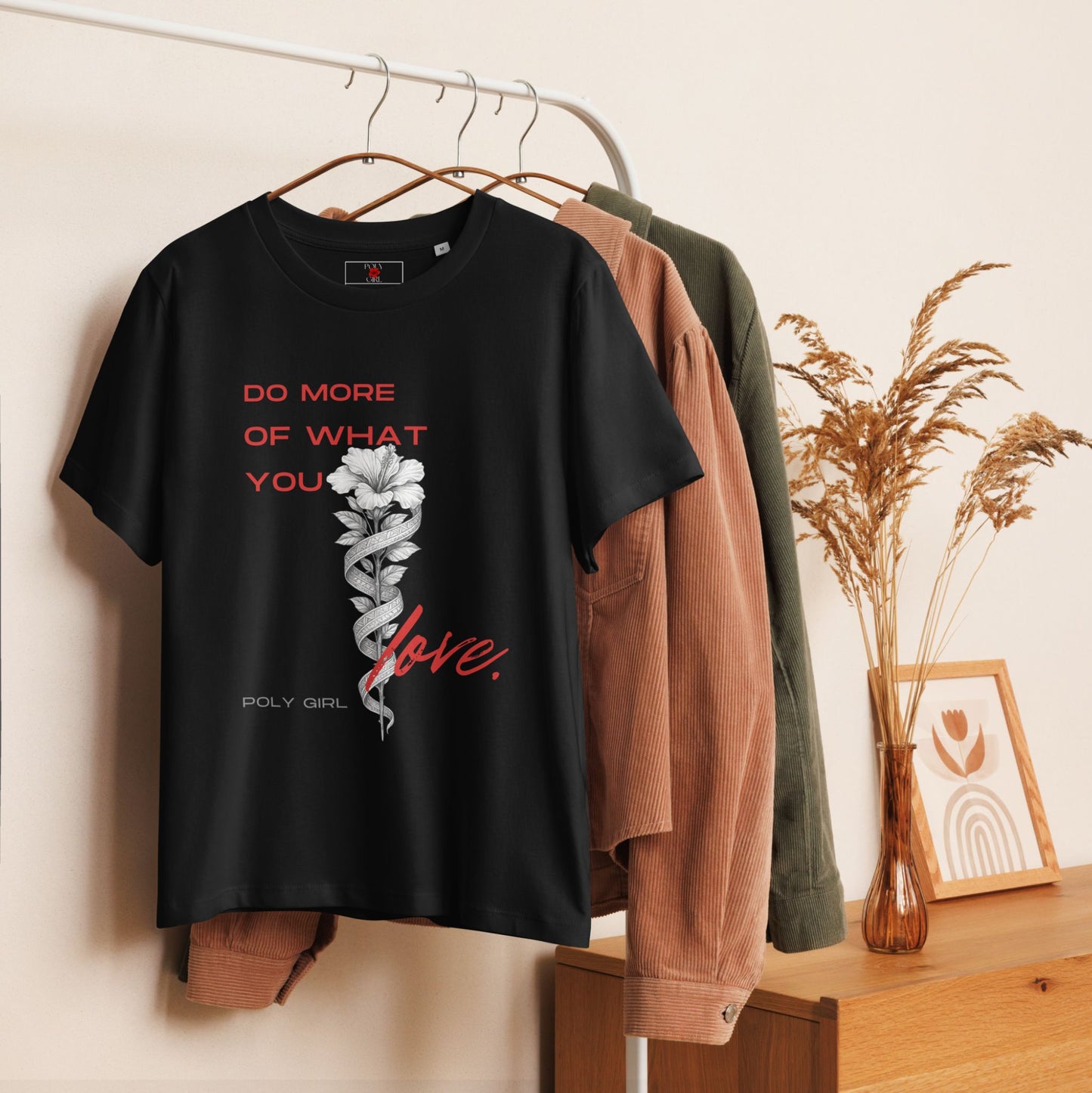 Do More Of What You Love Tshirt on a hanger