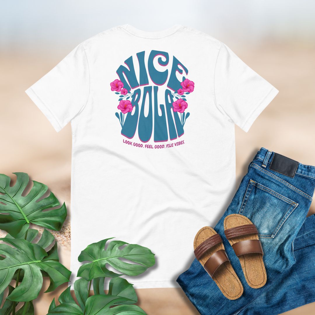 White t-shirt with 'Nice Bola' Fijian T-shirt graphic design, paired with jeans and sandals on a neutral background.