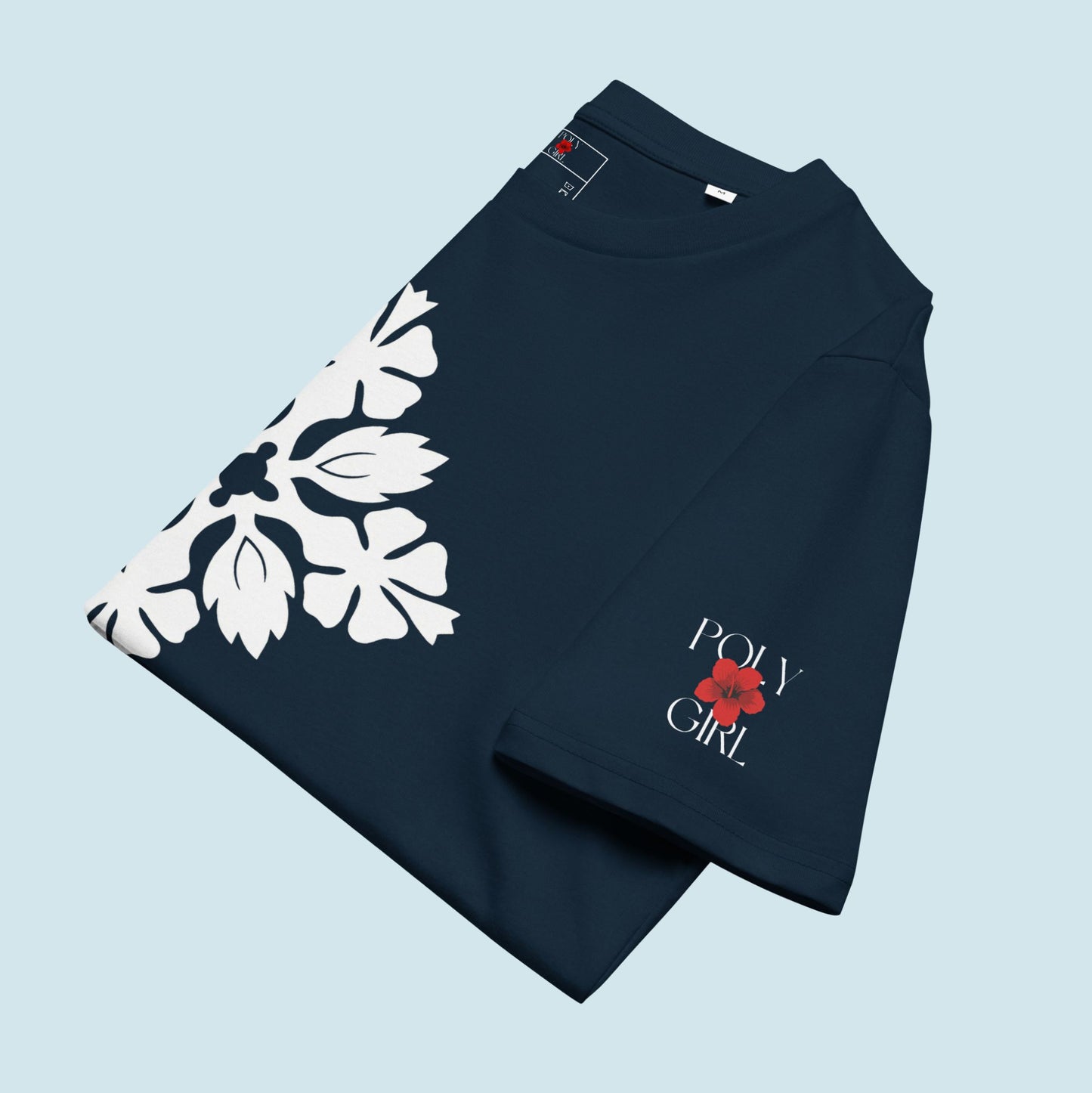 Folded Kapa Kuiki tee with Poly Girl logo on sleeve