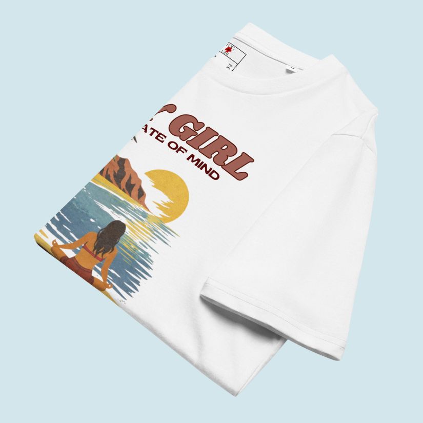 Folded white tee with a Poly Girl State of Mind graphic design on a light blue background