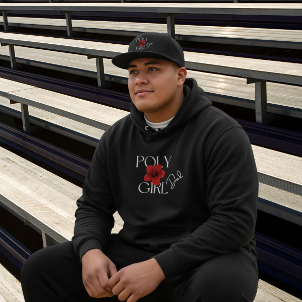 Person wearing a black hoodie with 'Girl Dad" text and red flower graphic, sitting on bleachers.