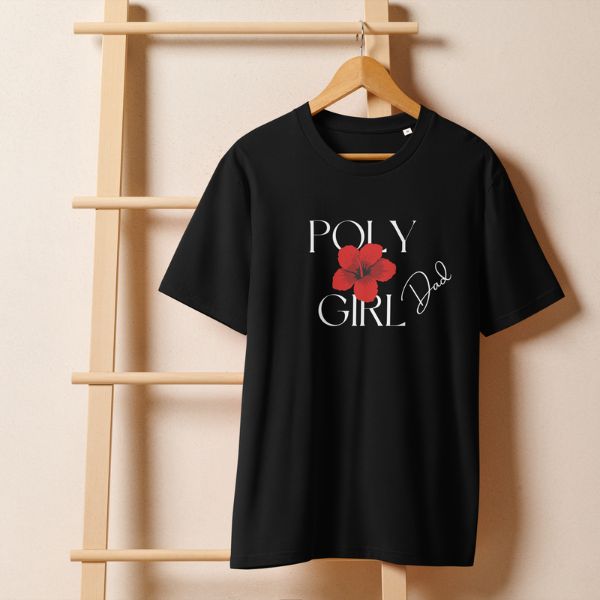 Black t-shirt with 'Girl Dad' text and red flower graphic on a wooden hanger against a beige wall.