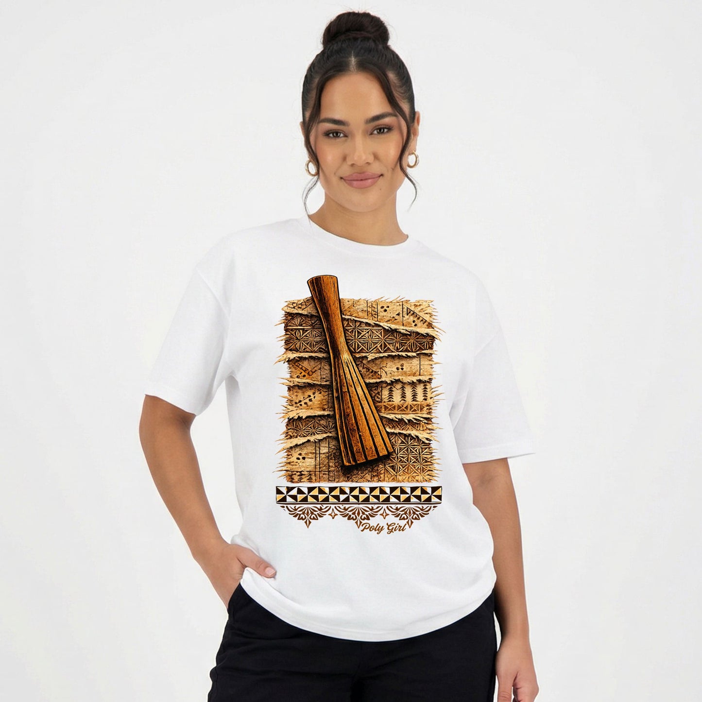 Woman wearing a white t-shirt with a graphic tapa cloth inspired design of a Ike and Kupesi by Poly Girl and manulua motif as undescore.