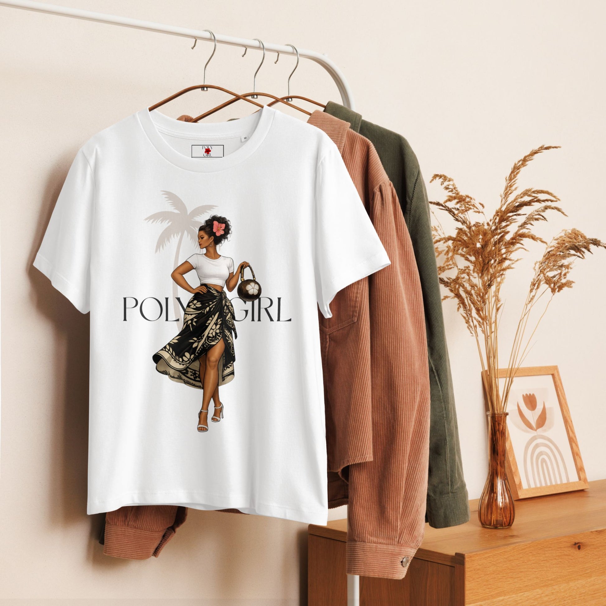 Island Chic Tee by Poly Girl handing on a clothe rack