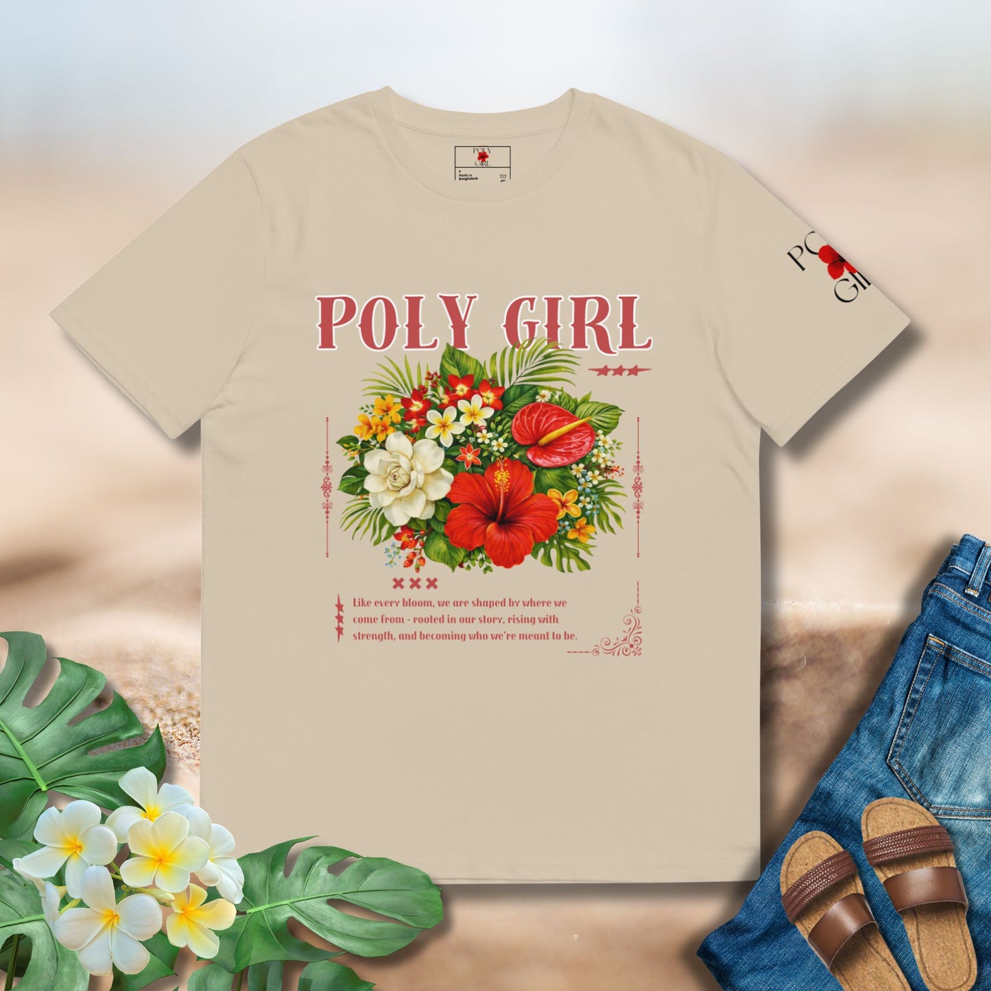 Beige t-shirt with floral design and 'Poly Girl' text on a neutral background