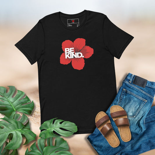 Black t-shirt with red flower and 'BE KIND' text, paired with jeans and sandals on a neutral background.