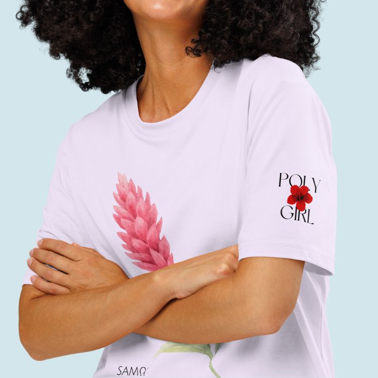 Person wearing a white t-shirt with a pink floral design and 'POLY GIRL' text on a light blue background