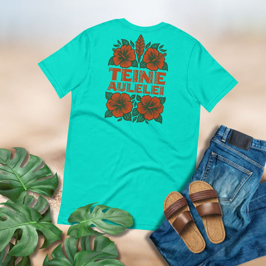 Turquoise t-shirt with floral design and text, Teine Auleleli, paired with jeans and sandals on a neutral background.