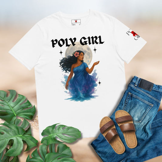 White t-shirt with 'Poly Girl' design featuring Polynesian Goddess of Moon, Hina,  in a blue dress and the moon behind her. Set on a background mockup with jeans, brown sandals, and tropcial leaves.