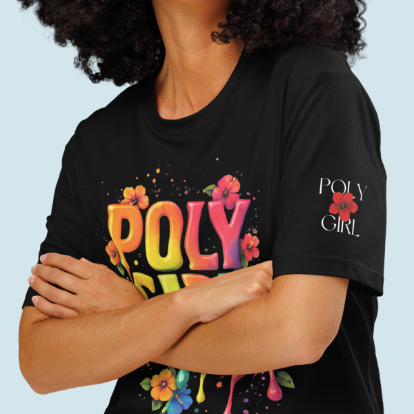 Person wearing Living Color black graphic tee with Poly Girl colorful design