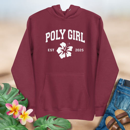 Maroon hoodie with 'Poly Girl Est 2025' text and hibiscus flower design on a neutral background.