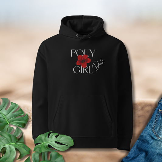 Black hoodie with 'Poly Girl Dad' text and red flower graphic on a beige background with green leaves and jeans.