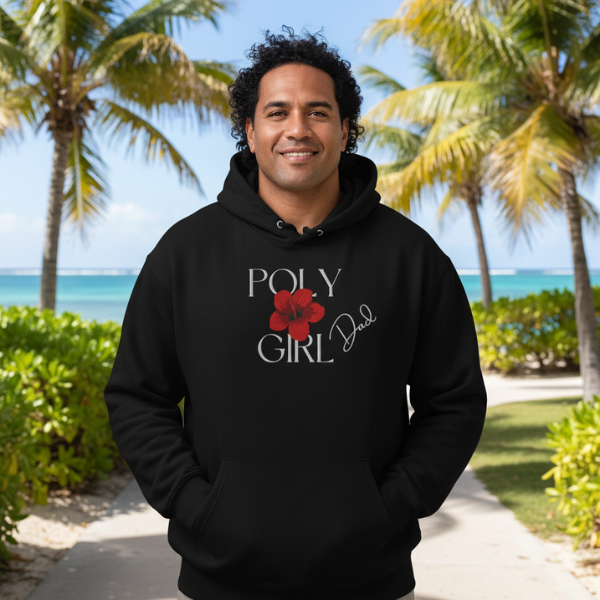Man wearing a black hoodie with 'Poly Girl Dad' text and red flower graphic, standing in front of palm trees and ocean.
