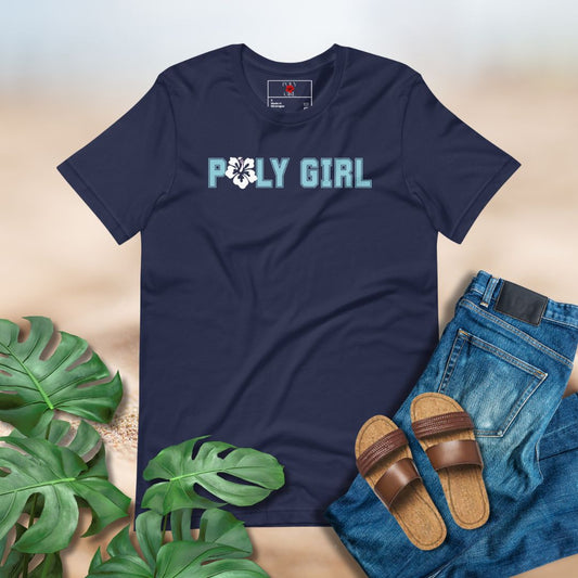 Navy blue t-shirt with 'POLY GIRL' text, paired with jeans, sandals, and green leaves on a neutral background