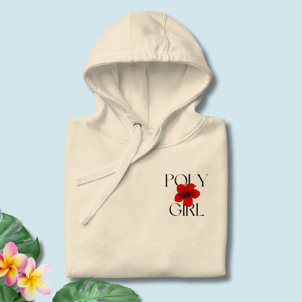Beige hoodie with 'POLY GIRL' and a red flower graphic on a light blue background with floral elements.