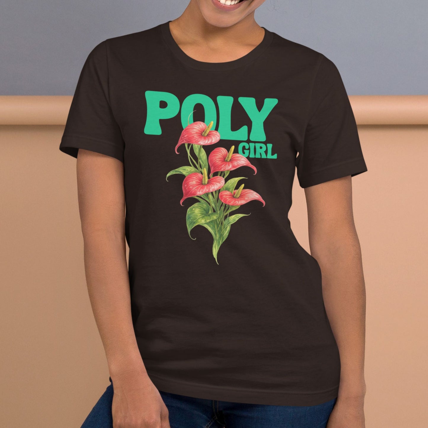 Person wearing brown tshirt with design of anthurium and Poly Girl