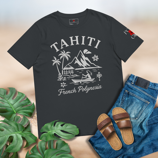 Black t-shirt with Tahiti design laid out on a wooden surface with jeans, sandals, and leaves.