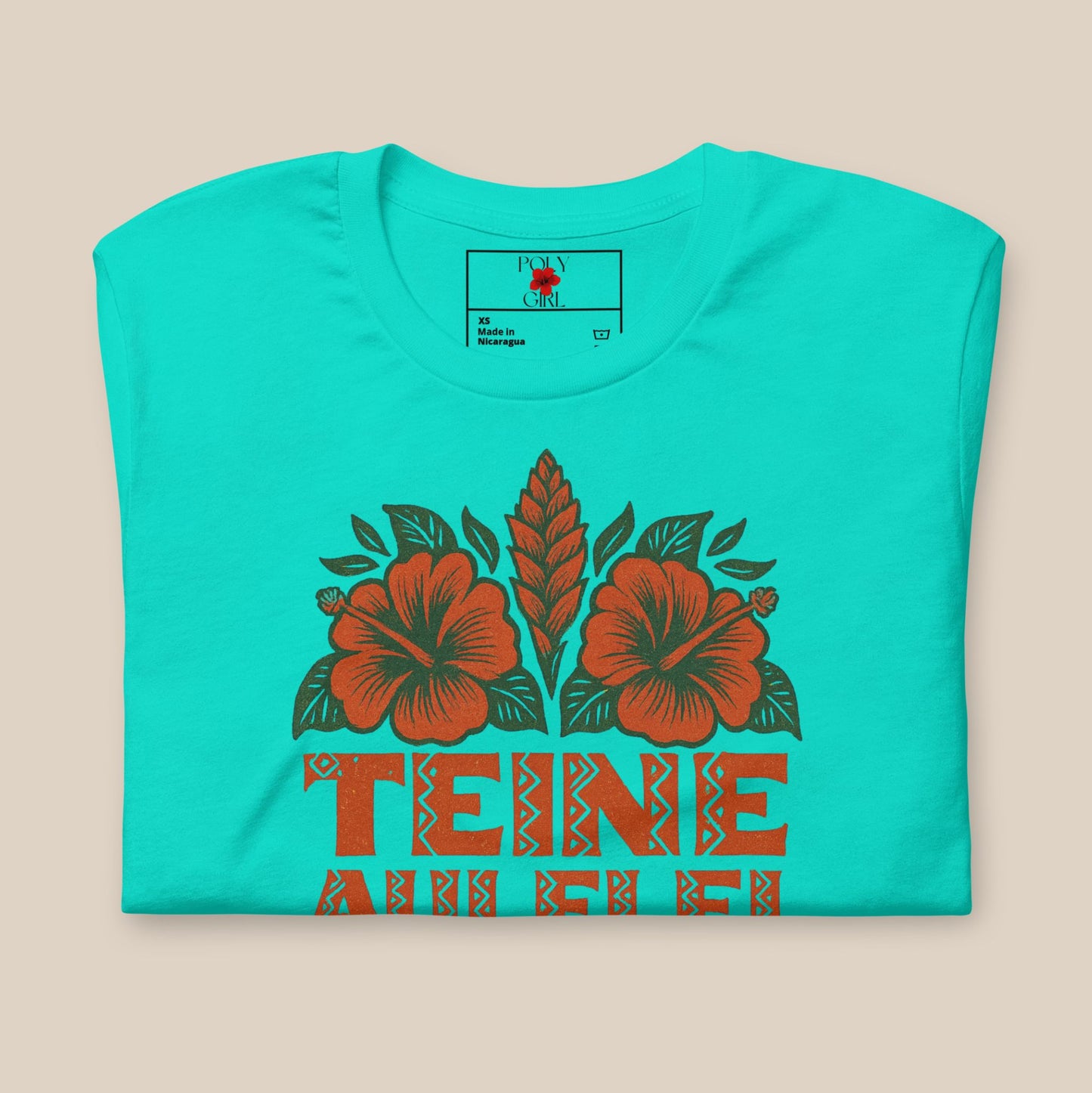 Teine Aulelei Tee by Poly Girl in teal folded