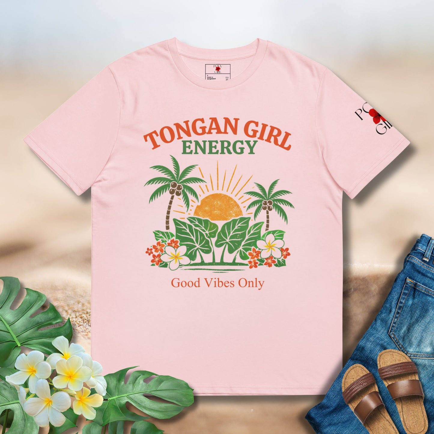 Pink t-shirt with tropical design and text on a light background
