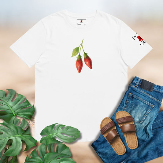 White t-shirt with red peppers design, blue jeans, brown sandals, and green leaves on a light background