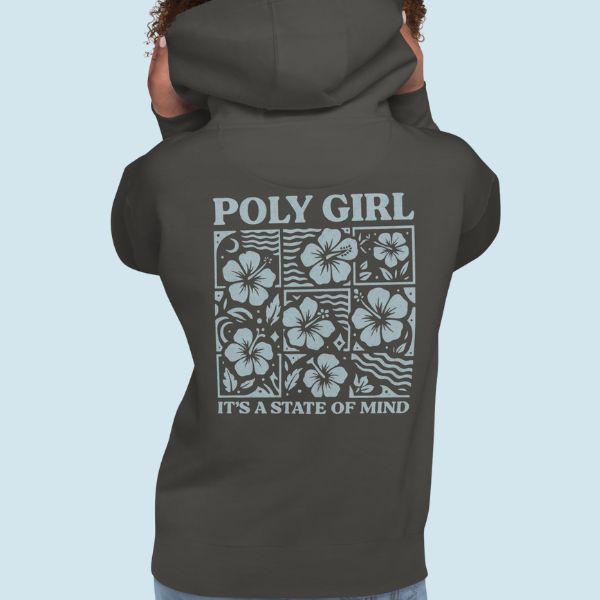 Person wearing a dark hoodie with 'Poly Girl It's a State of Mind' text and floral design on the back against a light blue background.