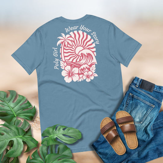 Blue T-shirt with graphic designof sun set and wave and palm tree with text Poly Girl, Wear Your Story paired with blue jeans, and sandals.